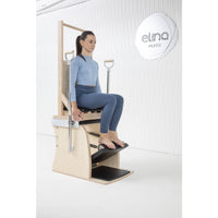 Thumbnail for Elina Pilates Combination Wunda  Electric Chair With A Woman Preparing For A Pilates Arm Chair Exercise
