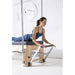 Elina Pilates Elite Cadillac Reformer Machine Angle View With A Woman Performing Cobra Pose Exercise
