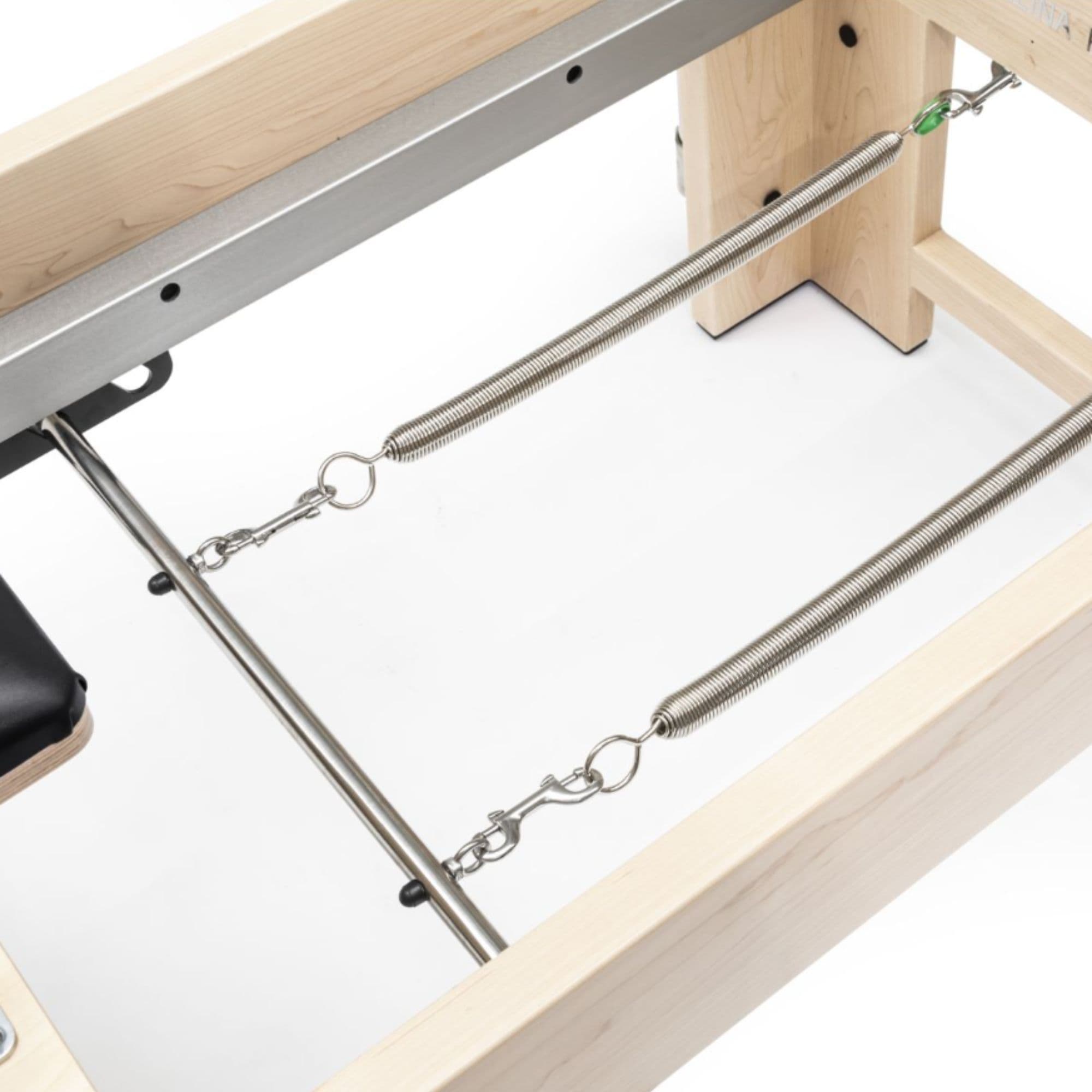 Elina Pilates Elite Cadillac Reformer Machine Close-Up View Of Spring Resistance System On White Background
