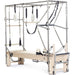 Elina Pilates Elite Cadillac Reformer Tan Or Ivory Variant Front Angled View Of Pilates Cadillac With Frame And Accessories