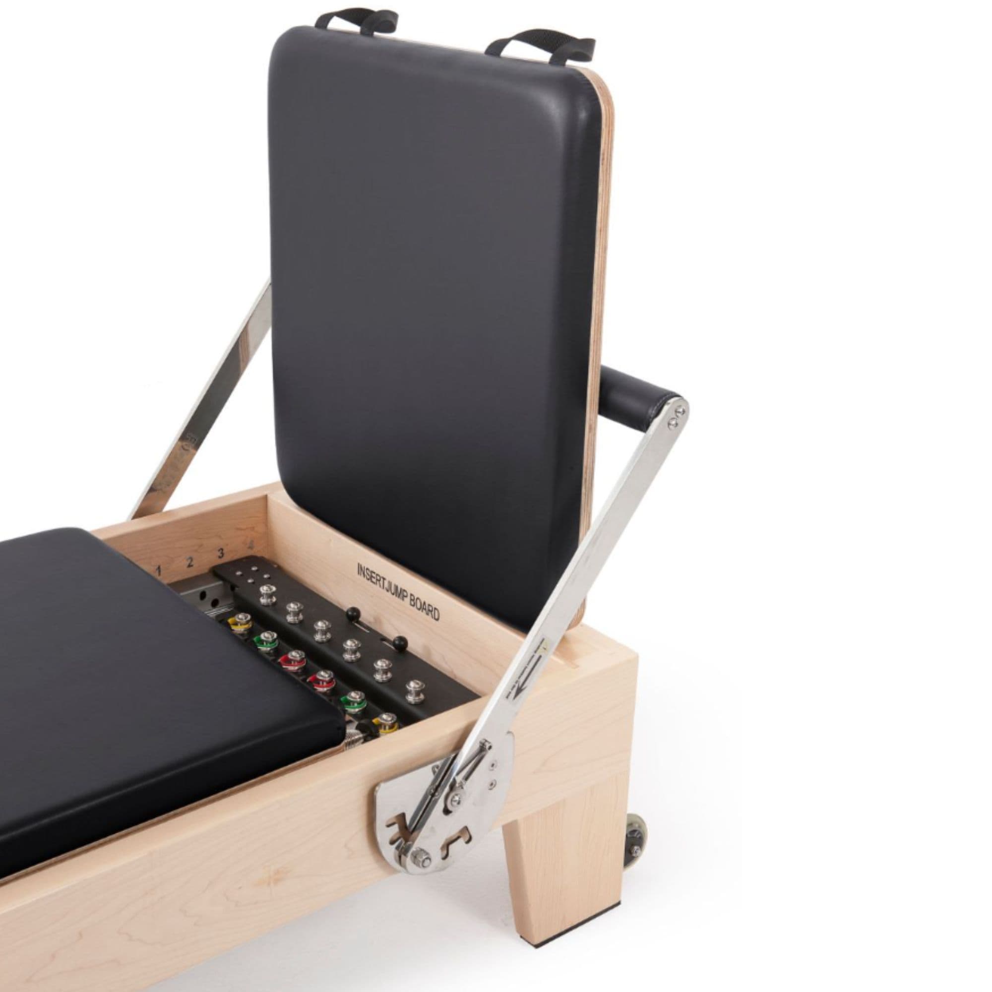 Elina Pilates Elite Wood Reformer Black Variant Close-Up View Of Jumpboard With Spring Resistance Controls On White Background