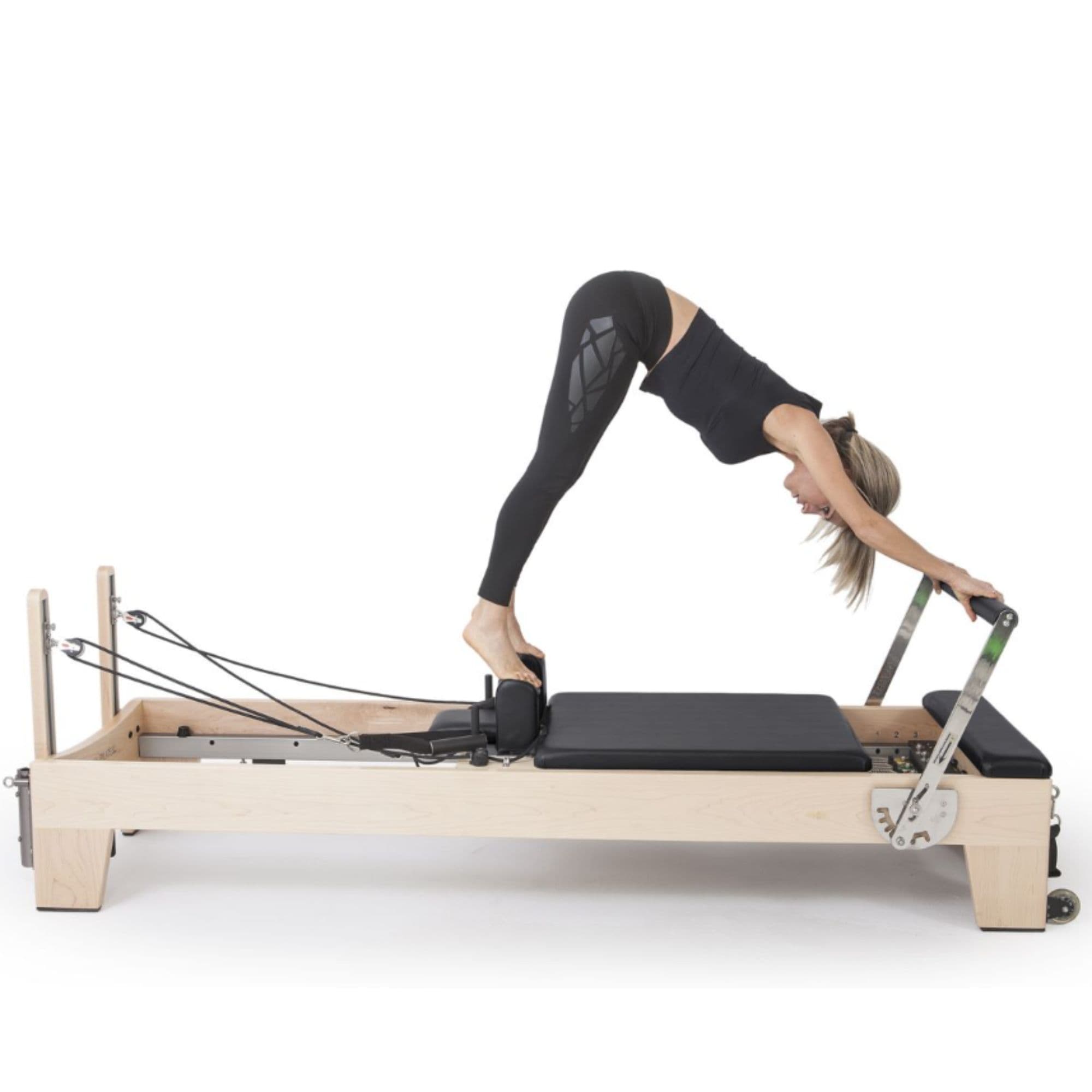 Elina Pilates Elite Wood Reformer Bundle Black Variant With A Woman Performing A Front Bend Exercise