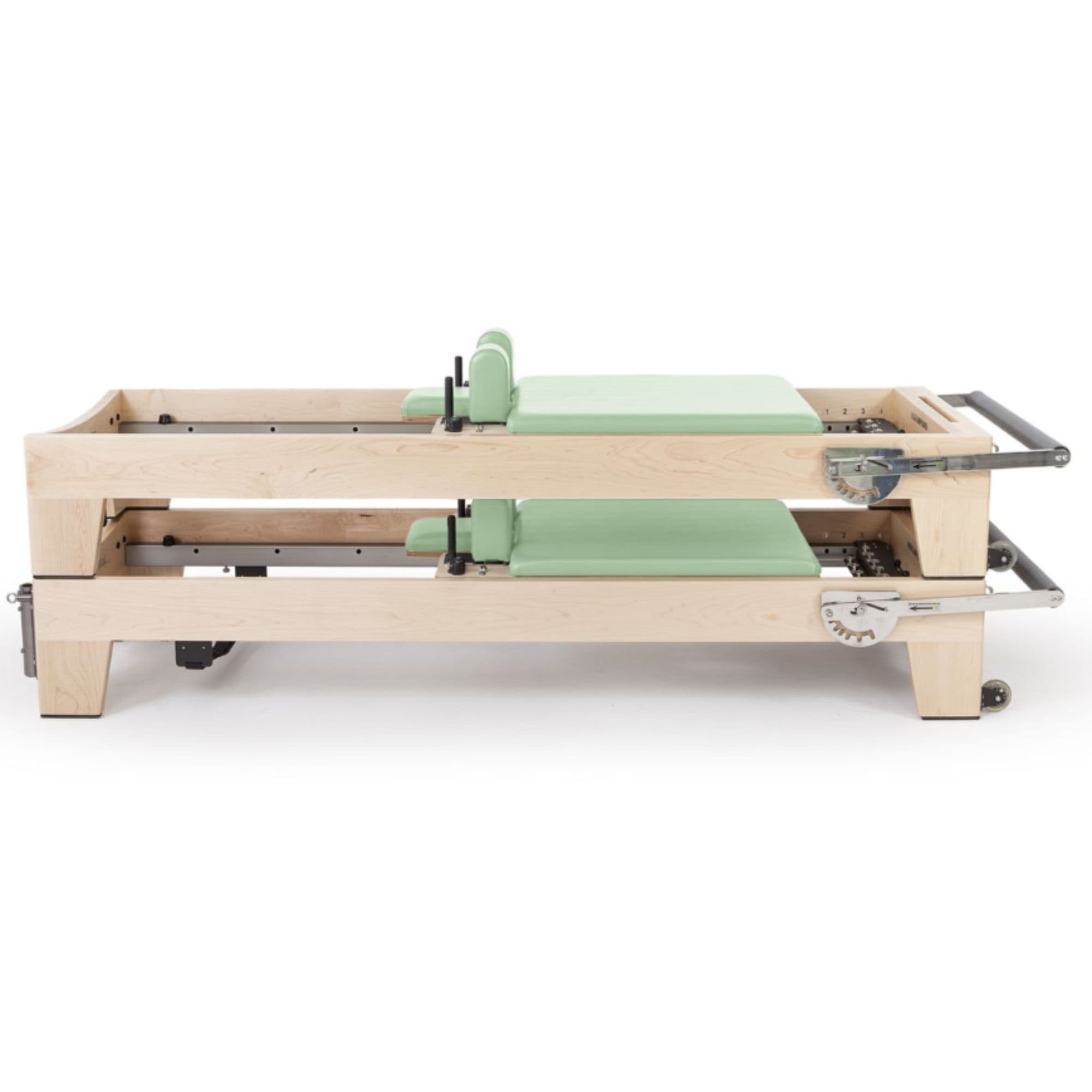 Elina Pilates Elite Wood Reformer Bundle Green Variant Side View In Two Stacked Storage Position On White Background