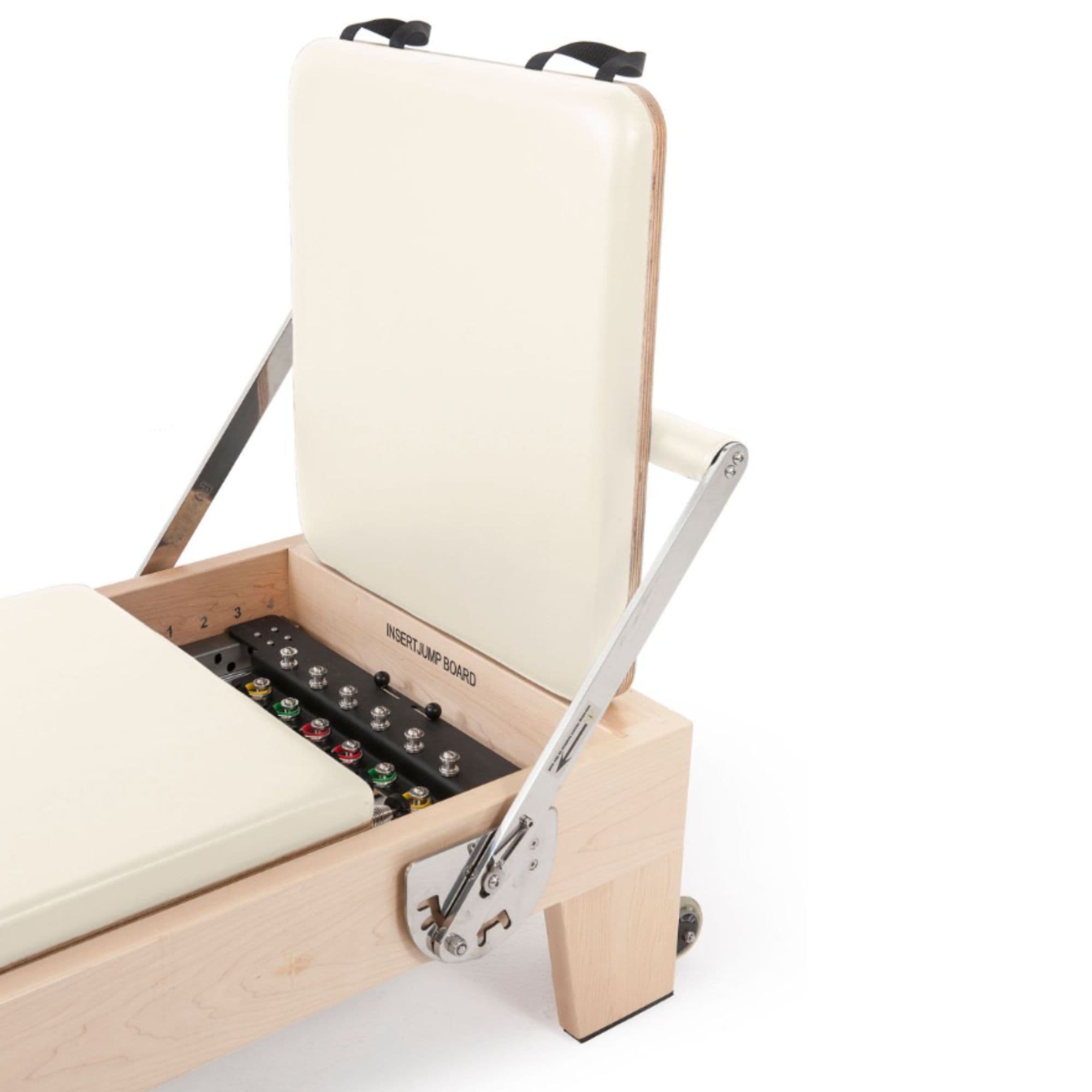 Elina Pilates Elite Wood Reformer Bundle Ivory Variant Close-Up View Of Jumpboard With Spring Resistance Controls On White Background