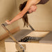 Elina Pilates Elite Wood Reformer Gray Variant With Woman Performing A Stretch Exercise