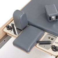 Thumbnail for Elina Pilates Elite Wood Reformer & Tower Set Close-Up View Of Shoulder Blocks And Sitting Box Attachment Components