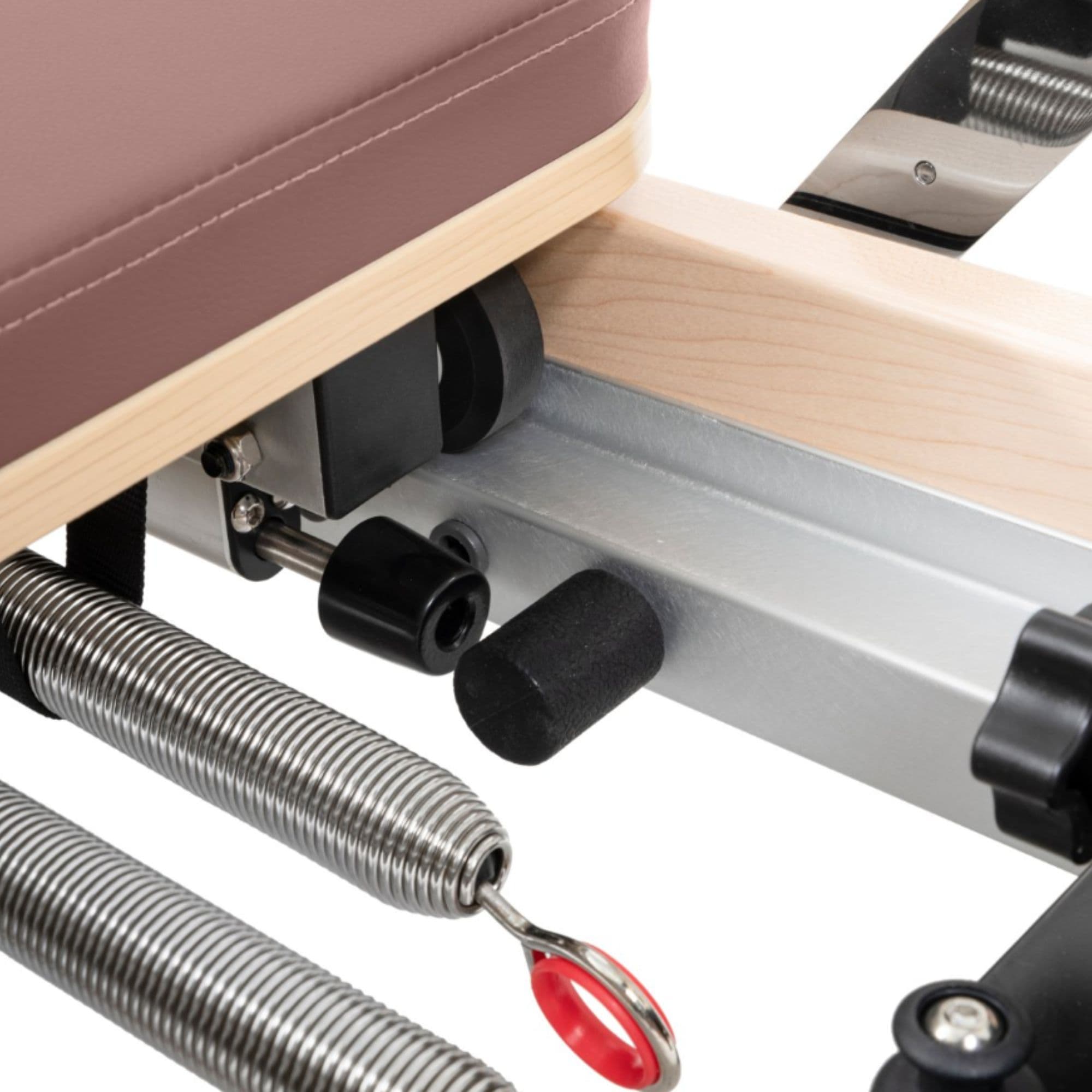 Elina Pilates Foldable Reformer With Box Close-Up View Of Spring Resistance System On White Background