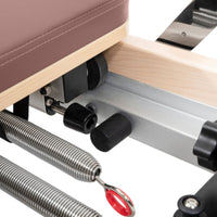 Thumbnail for Elina Pilates Foldable Reformer With Box Close-Up View Of Spring Resistance System On White Background
