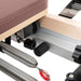 Elina Pilates Foldable Reformer With Box Close-Up View Of Spring Resistance System On White Background