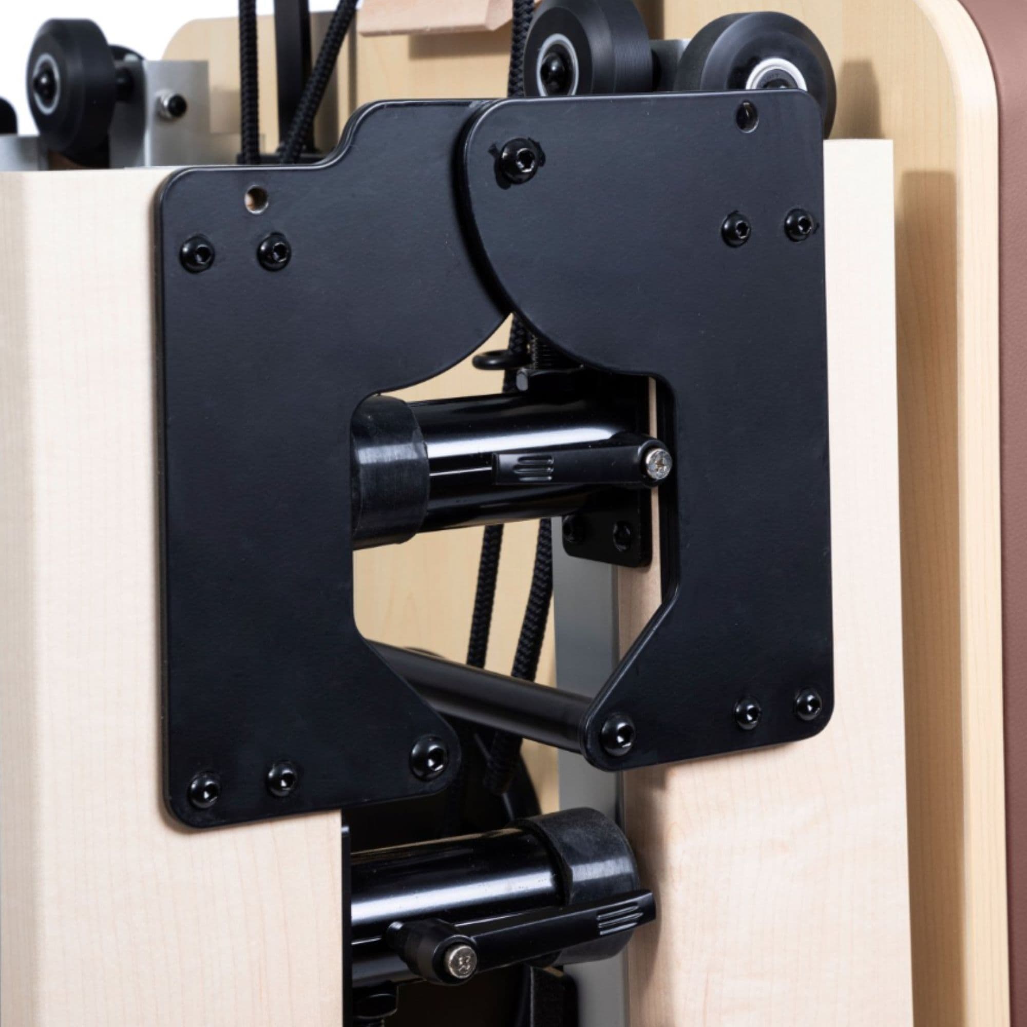 Elina Pilates Foldable Reformer for Home Close-Up View Showing Folding Lock System And Transport Wheels