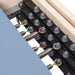 Elina Pilates Master Instructor Physio Reformer And Tower Set Close-Up View Of Color Coded Spring Resistance Controls On White Background