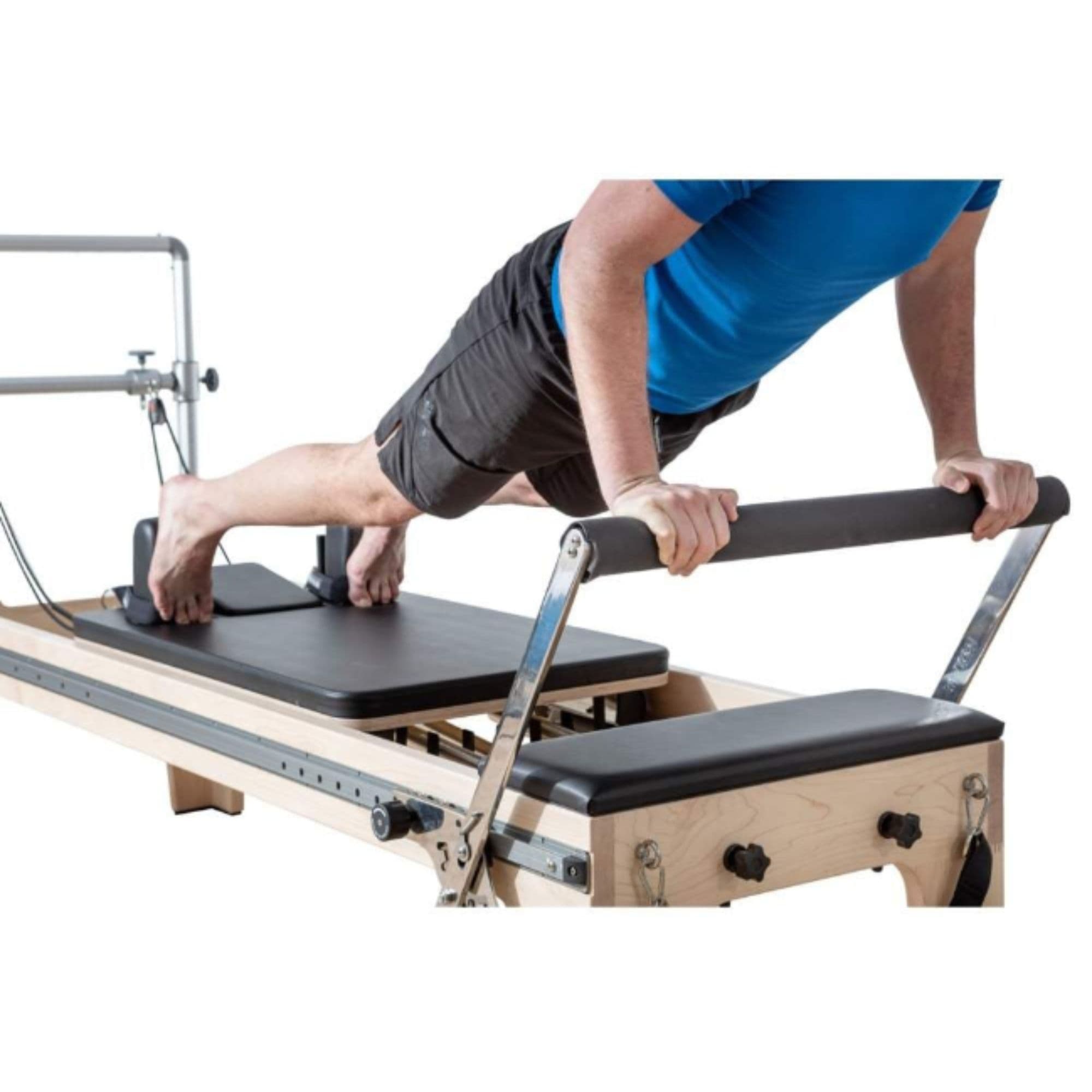 Elina Pilates Master Instructor Wood Reformer With A Man Performing A Push-up Exercise On Footbar