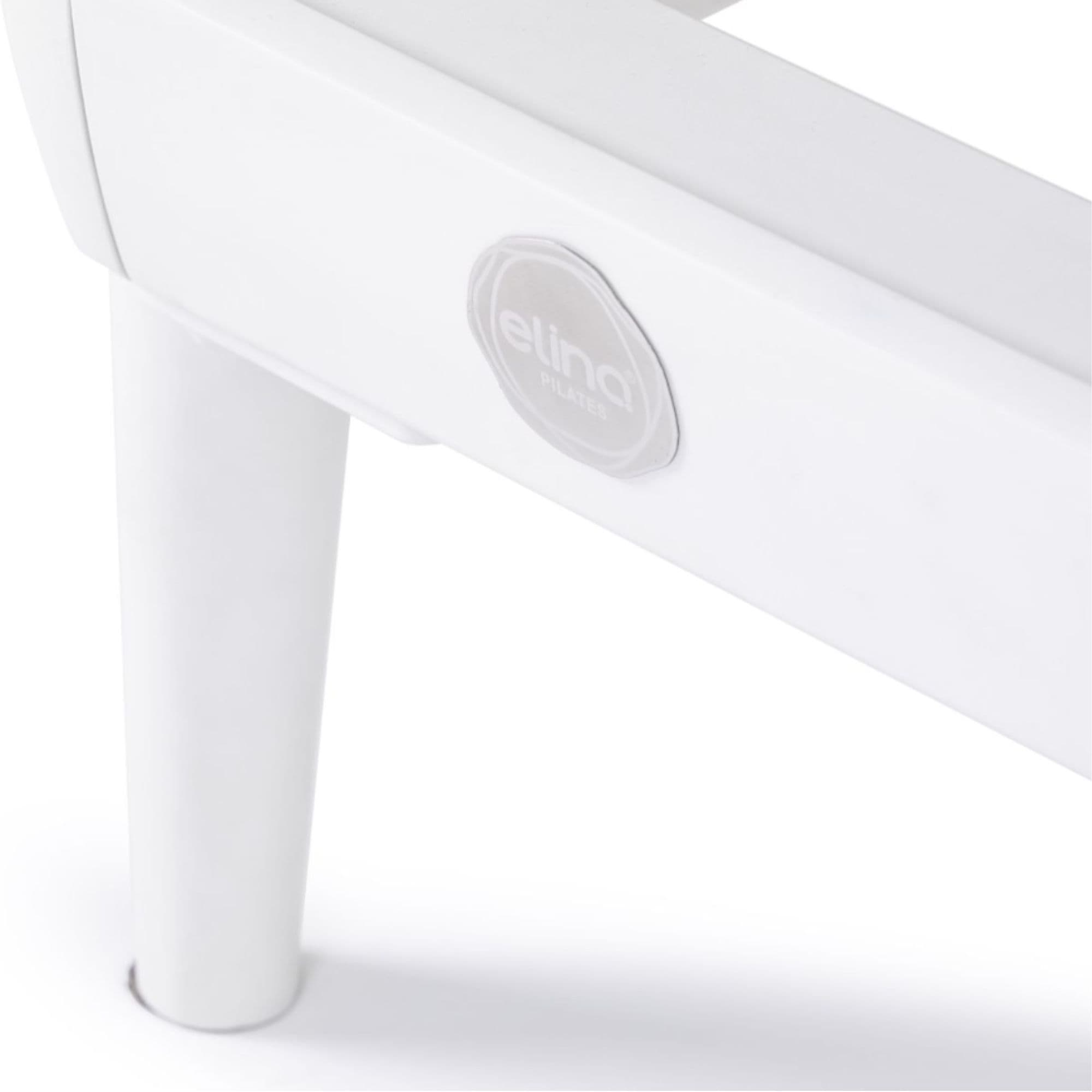 Elina Pilates Nubium Reformer Bundle Close-Up View Of Logo Badge And Support Leg On White Background