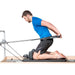 Elina Pilates Physio Reformer Master Instructor With A Man Performing A Kneeling Pilates Exercise Using A Waist Belt