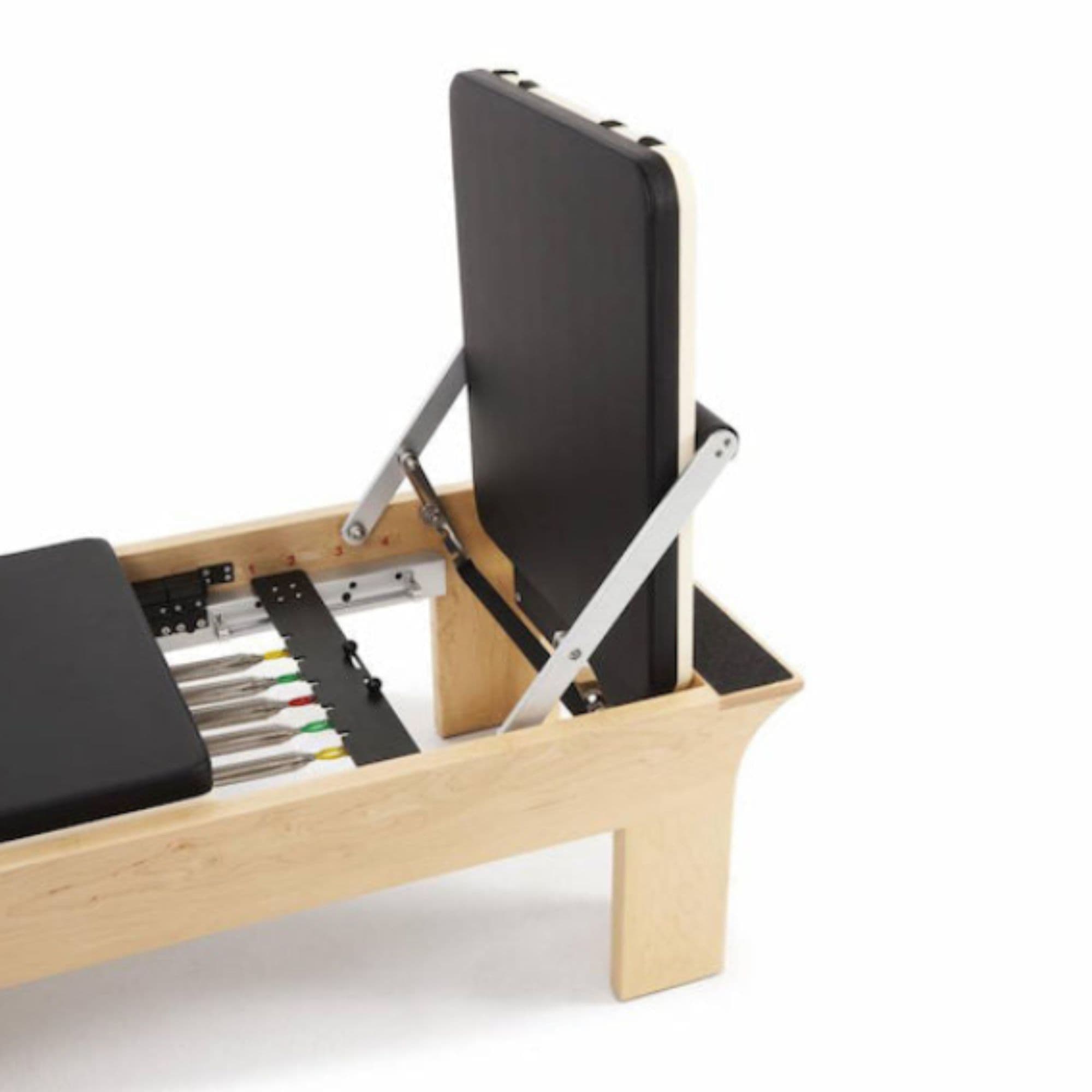 Elina Pilates Physio Wood Reformer with Tower Black Variant Close-Up View Of Jump Board And Color Coded Resistance Springs