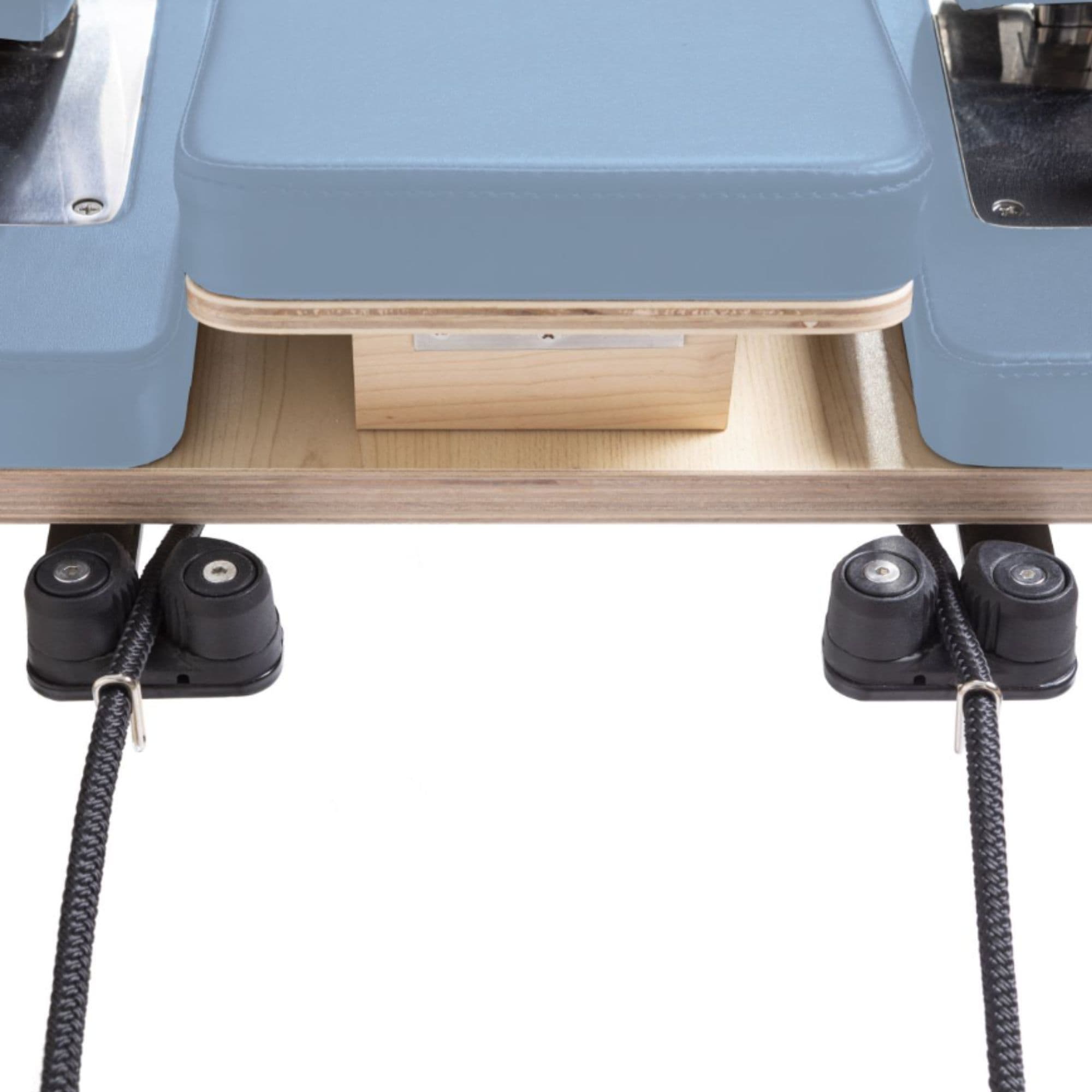Elina Pilates Reformer Master Instructor And Tower Set Close-Up View Of Reformer Rope Guide Pulleys On White Background