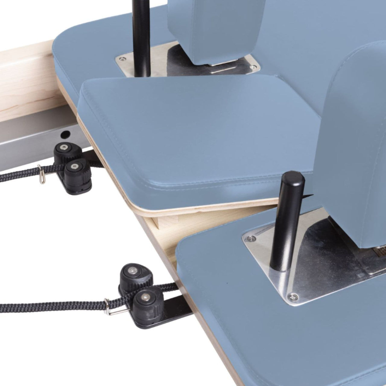 Elina Pilates Reformer Master Instructor With Tower Close-Up View Of Reformer Rope Guide Pulleys On Ocean Blue Upholstered Bed