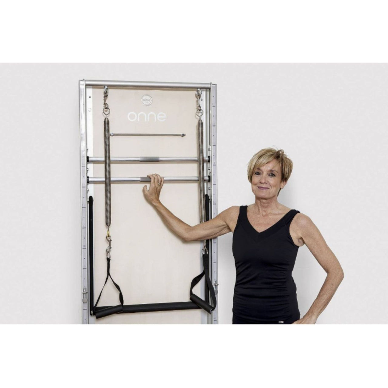 Elina Pilates Wall Board ONNE Basic Variant With A Woman Pose Beside