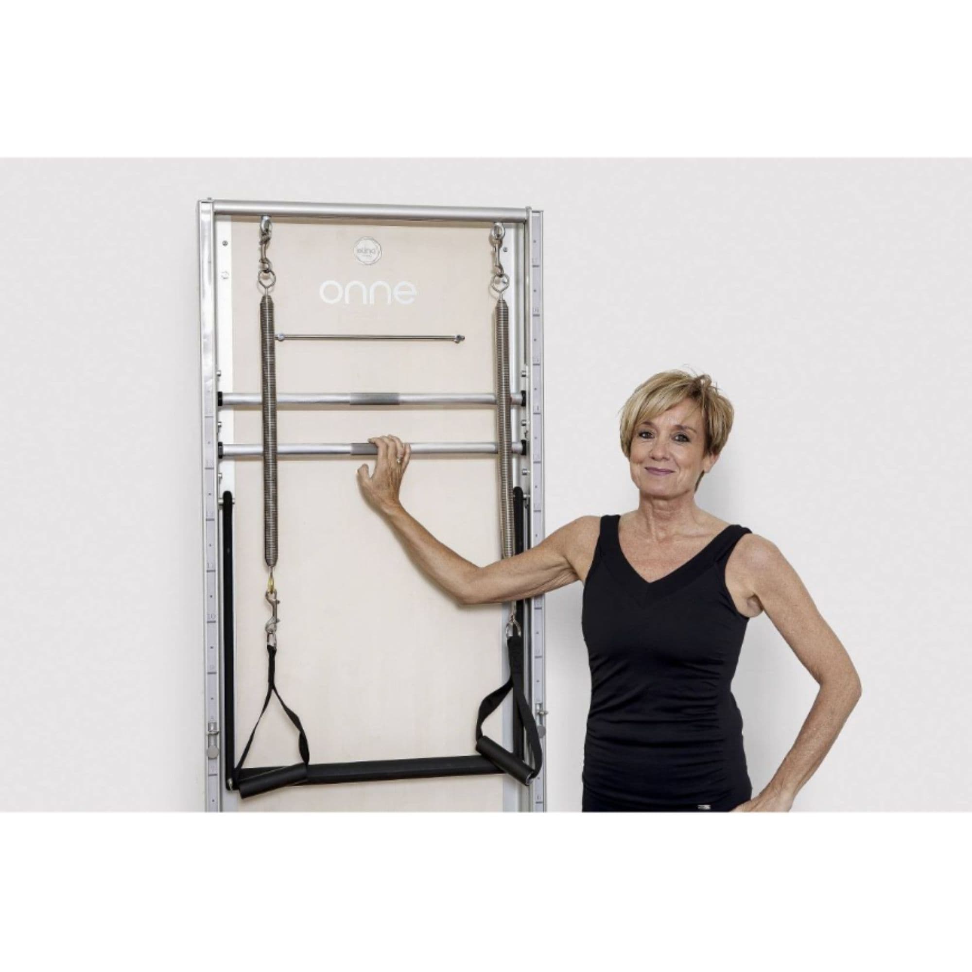 Elina Pilates Wall Board ONNE Basic Variant With A Woman Pose Beside