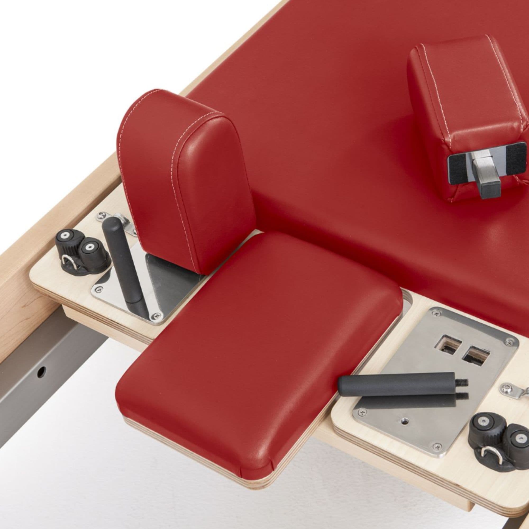Elina Pilates Wood Reformer Elite Red Variant Close-Up View Of Shoulder Blocks And Sitting Box Attachment Components
