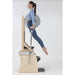 Elina Pilates Wunda Electric Chair Side View Of A Woman Demonstrating A Body Lift Exercise