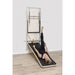 Elina Pillates ONNE Wall Board System With A Woman Performing Exercise Using A Band