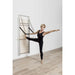 Elina Wall Board ONNE With A Woman Performing Standing Side Leg Stretch Exercise