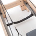 Elite Wood Reformer with Tower Close-Up View Of Strap And Frame On White Background