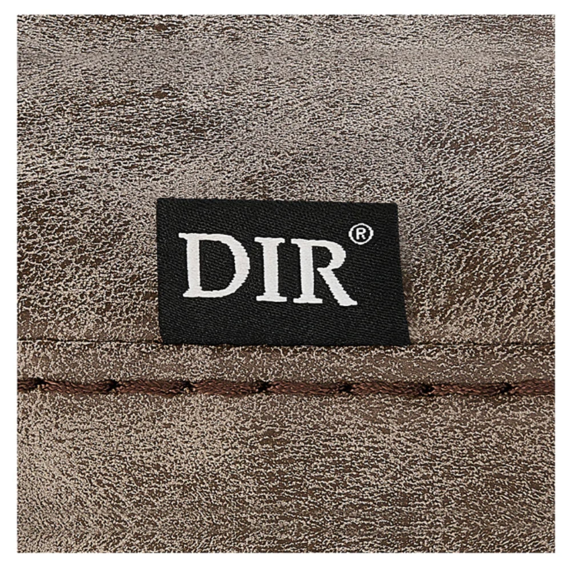 Esquire Reclining Barber Chairs Close-Up View Of Vintage Brown Upholstery With Horizontal Stitching And Brand Name