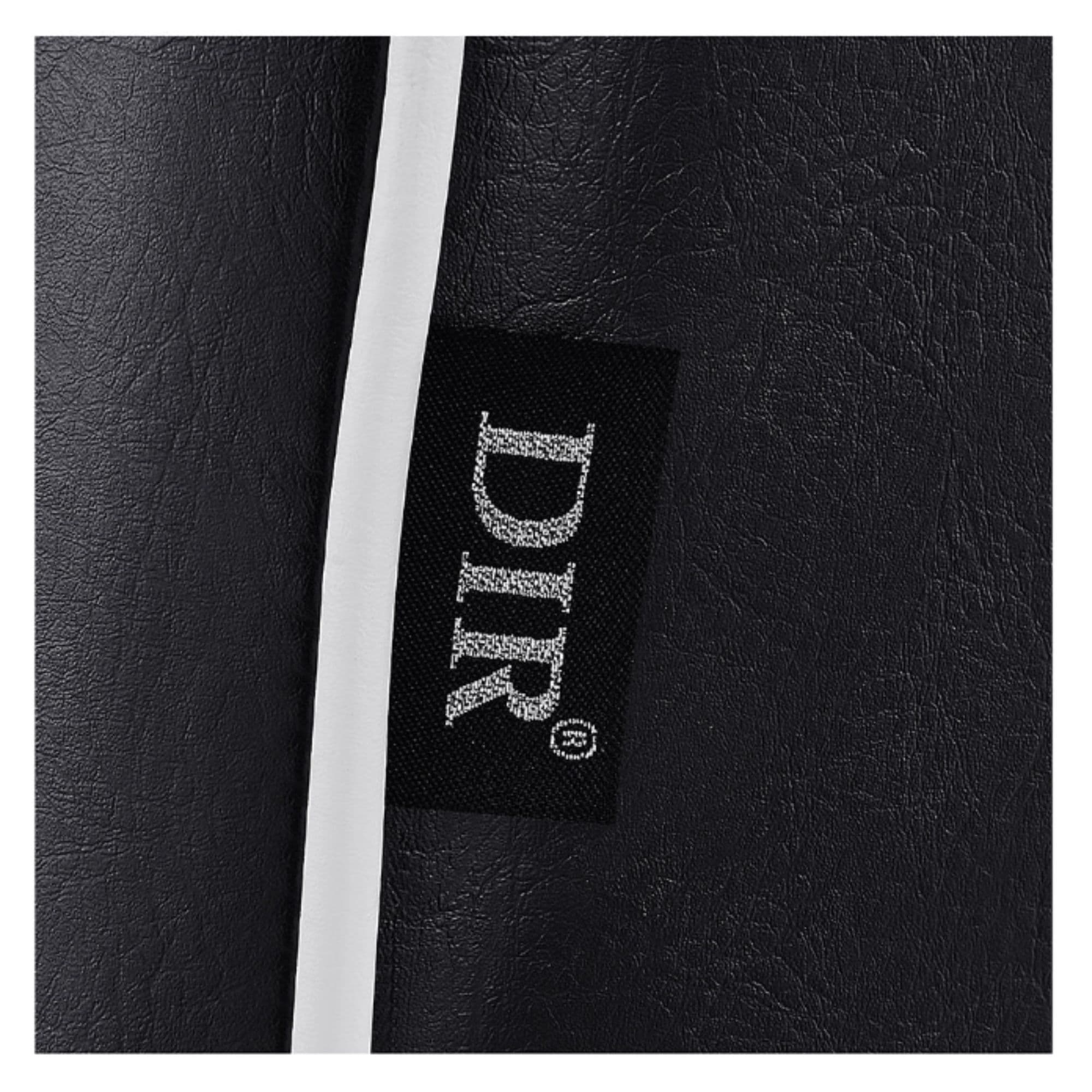 Executive All Purpose Reclining Chair Close-Up View Of Black Upholstery With Brand Name