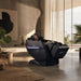 Floridian Rebel Zero Gravity 4D Massage Chair Side Angle View With Woman Enjoying In Luxury Overlooking Greenery Living Room