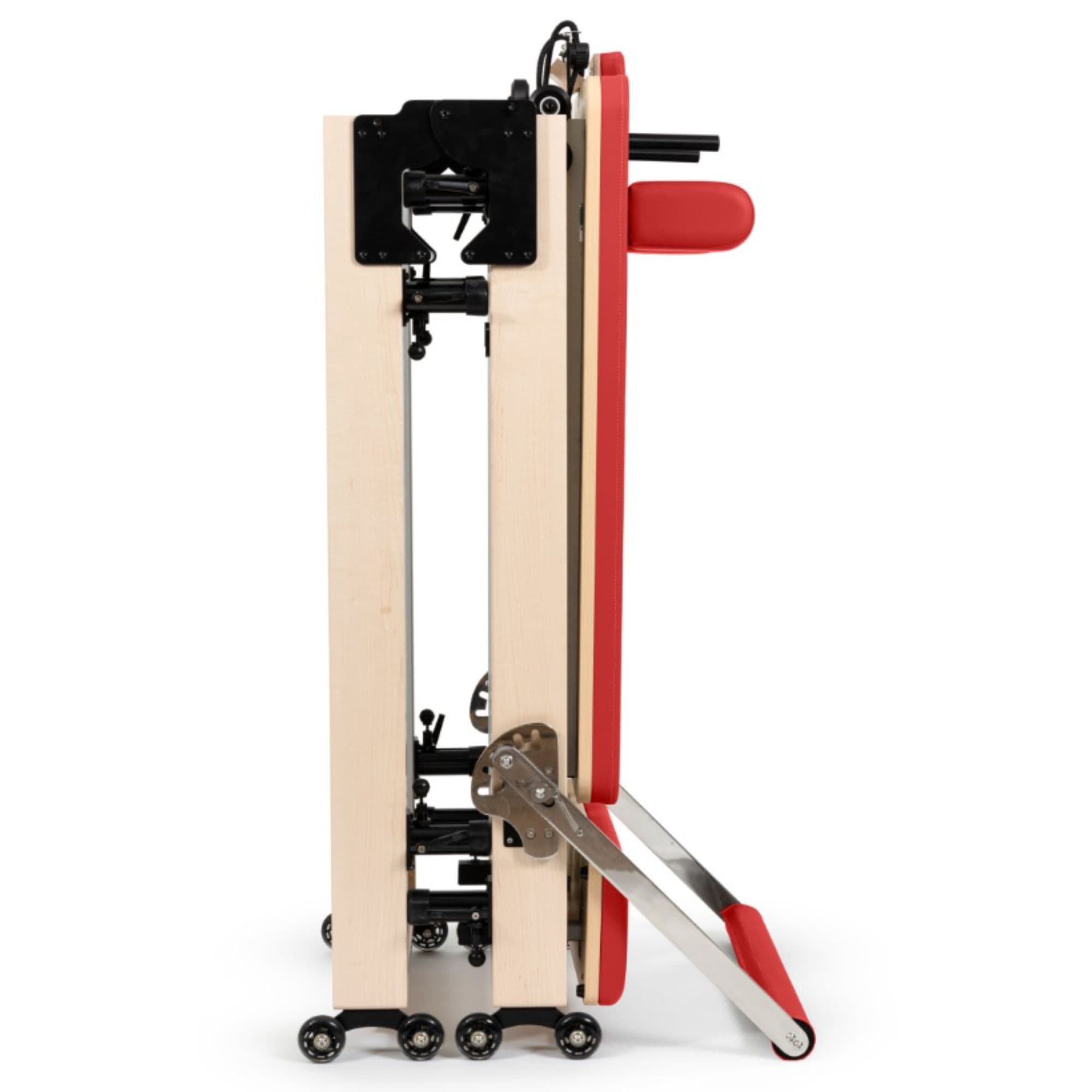 Home Foldable Reformer Red Variant Side View Showing Space-Saving Folded Configuration On White Background