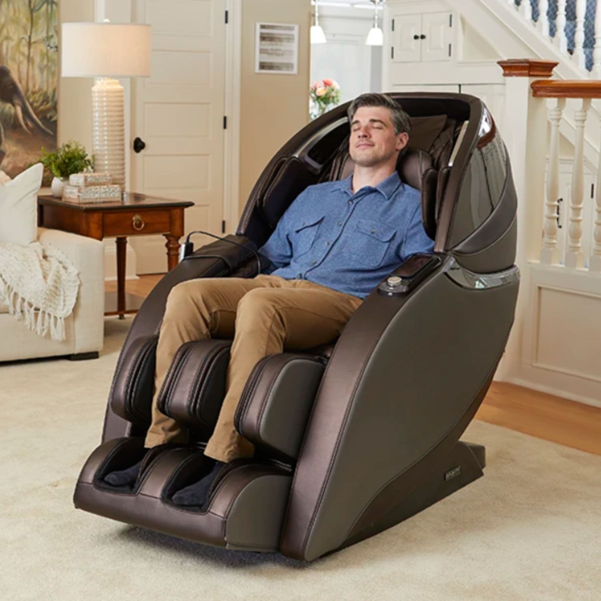 Infinity Evolution Massage Chair Front Angled View Of A Man Enjoying The Massage In A Modern Living Room