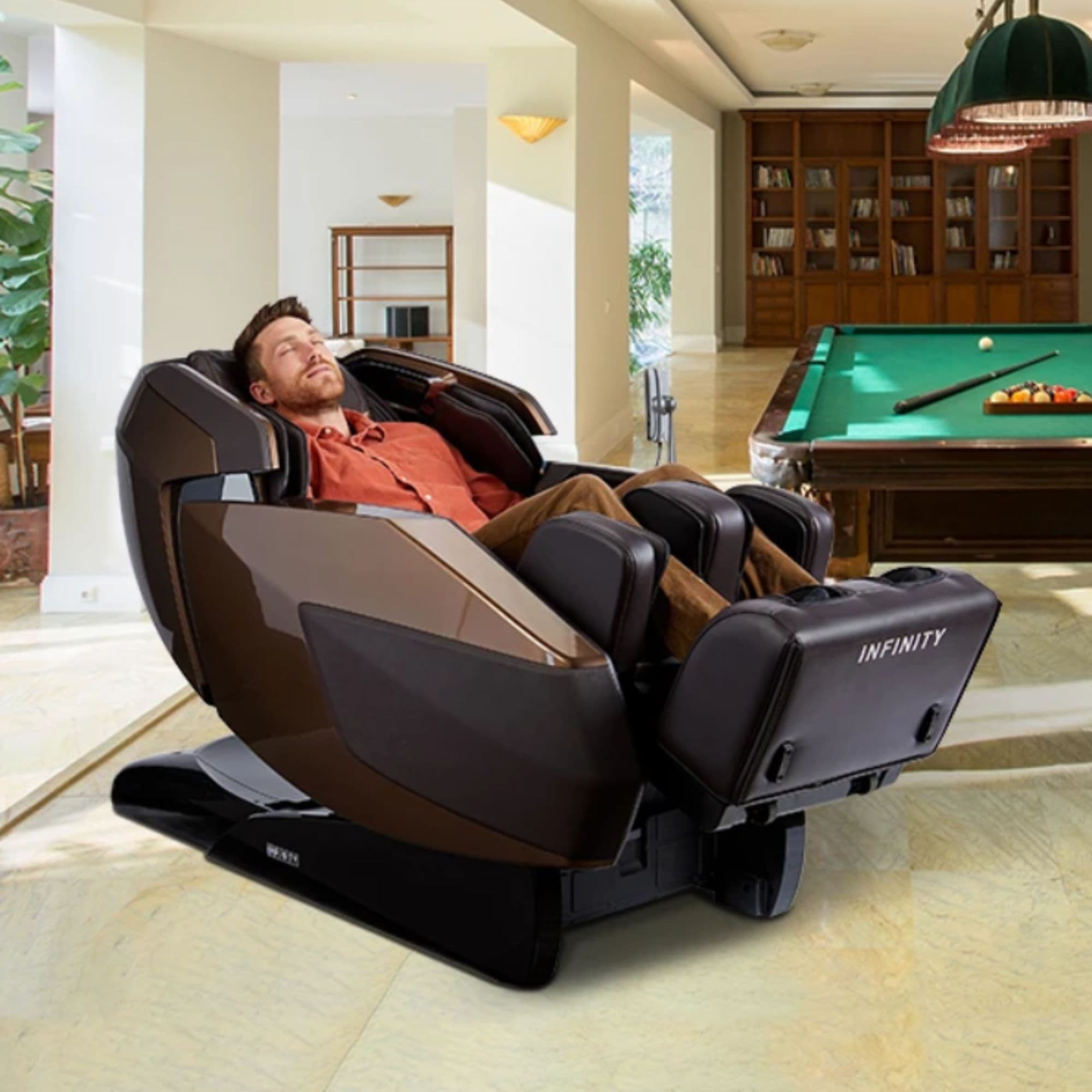 Infinity Imperial Massage Chair Certified Pre-Owned Dark Front Angled View Of A Man Relaxing In A Modern Recreation Room