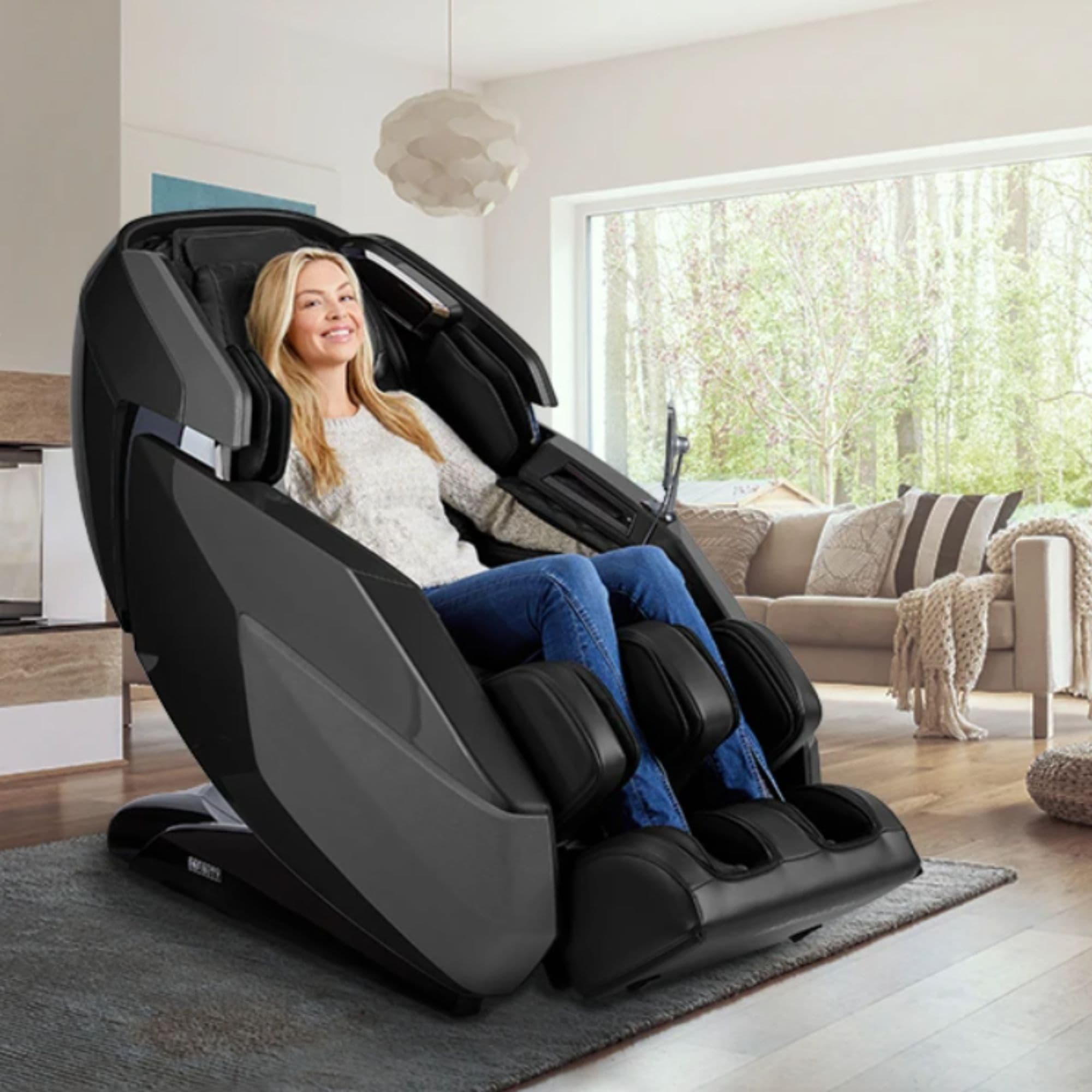Infinity Imperial Massage Chair Certified Pre-Owned Dark Front Angled View With A Woman Relaxing In A Modern Living Room Setting