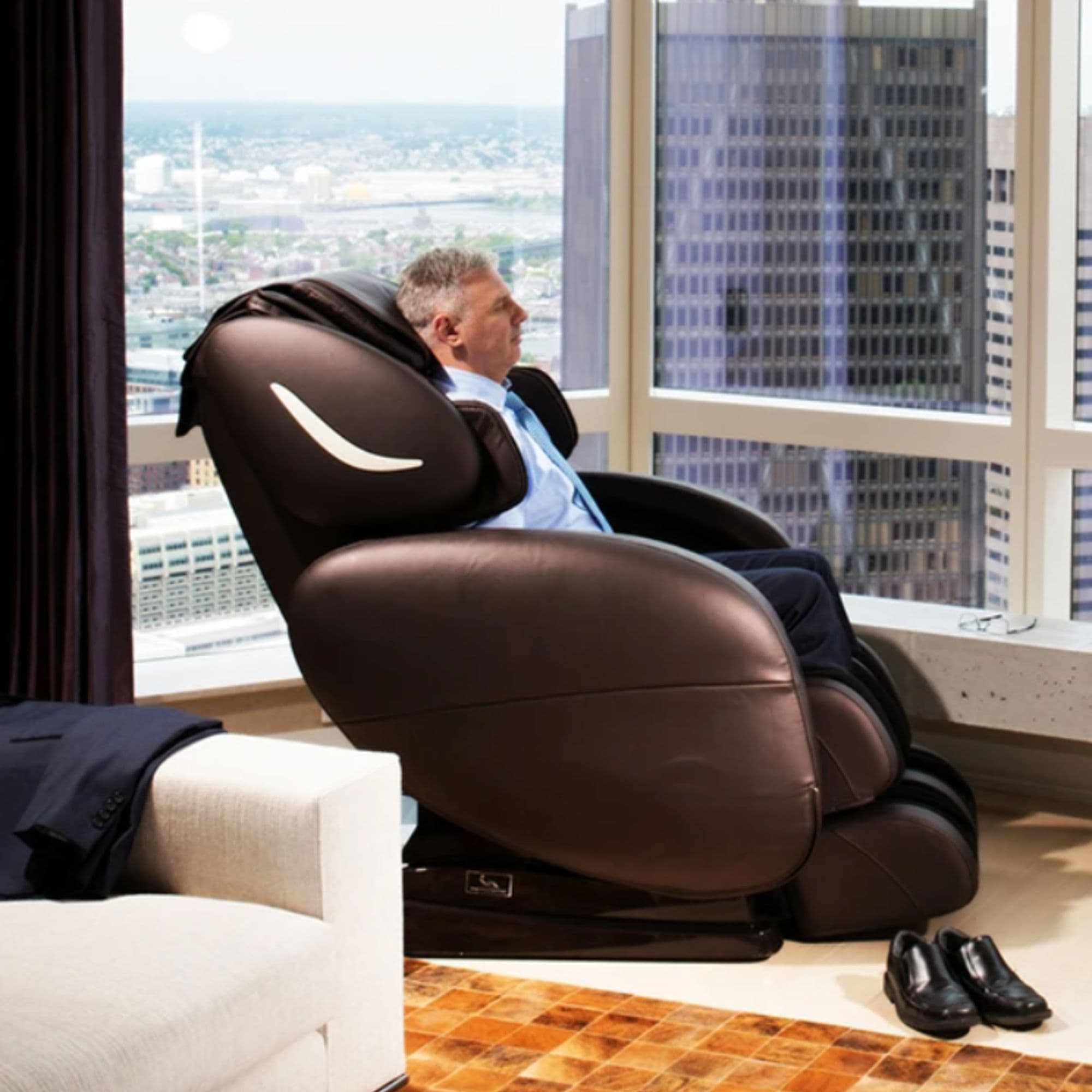 Infinity Smart Chair X3 Massage Chair Black Variant With A Man Sitting In The Massage Chair