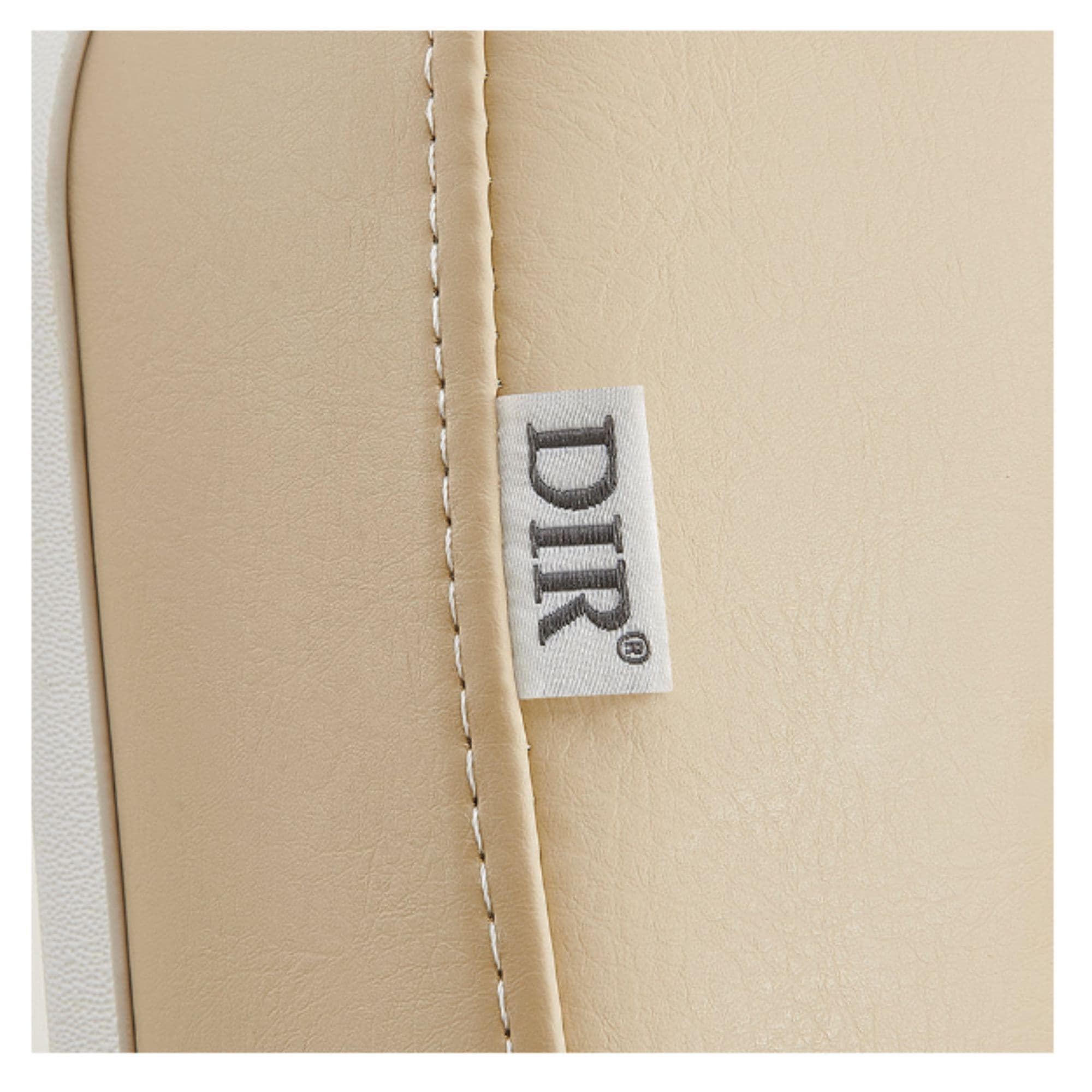 Libra 5-Motors Electric Medical Procedure Chair with Split Legs Close-up View Of Beige Upholstery With Brand Name