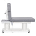 Luxi 4-Motors Medical Spa Treatment Bed Side View Of Gray Color And Fully Reclined On Head Section With Remote Control On White Background