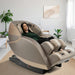 M878 Massage Chair Gold-Tan Variant Front Angled View Of A Woman Relaxing In A Modern Living Room With Indoor Potted Plants