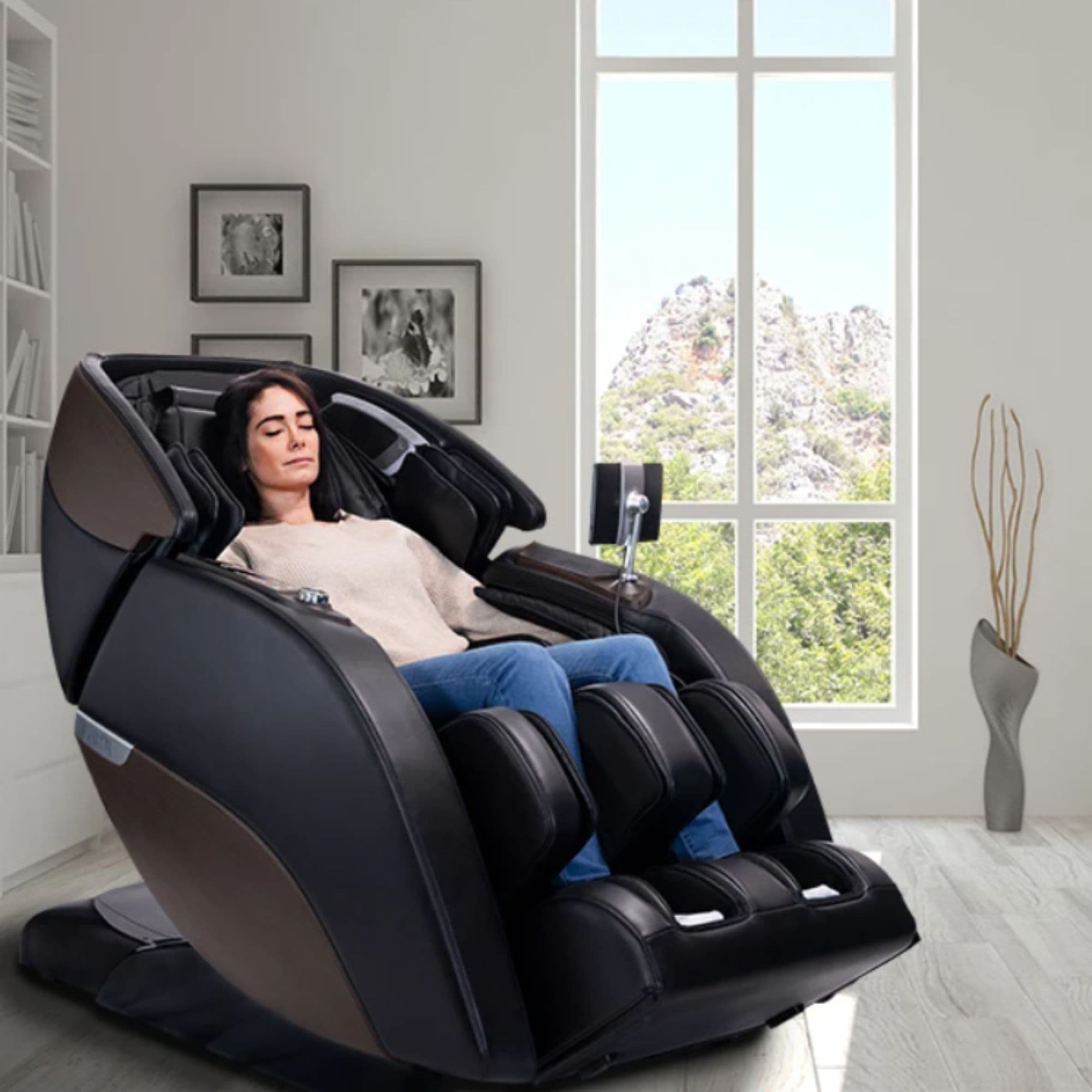 M980 Syner-D Massage Chair CPO Front Angled View Of A Woman Relaxing With Mountain Views