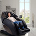 M980 Syner-D Massage Chair CPO Front Angled View Of A Woman Relaxing With Mountain Views