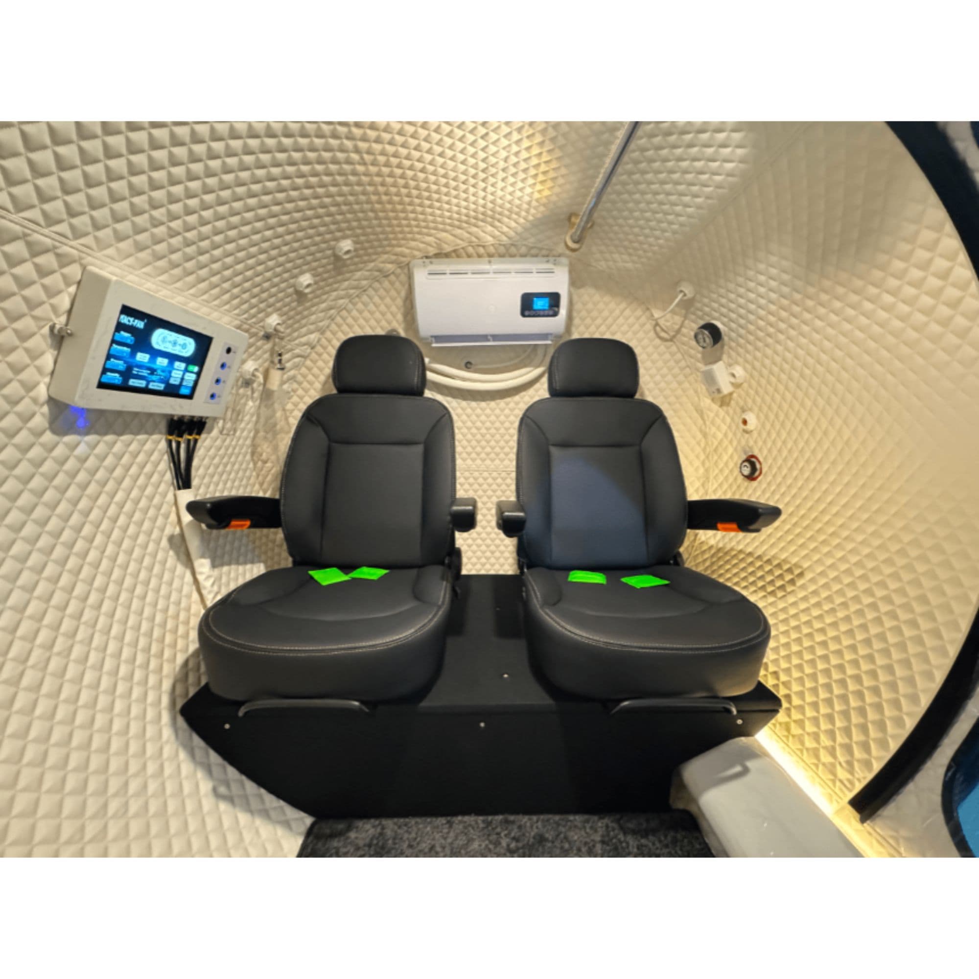 Macy Pan HE5000 Multiplace Hyperbaric Chamber – 5 Person Hard Shell 1.5–2.0 ATA Interior View With Two Black Chairs And Accessories