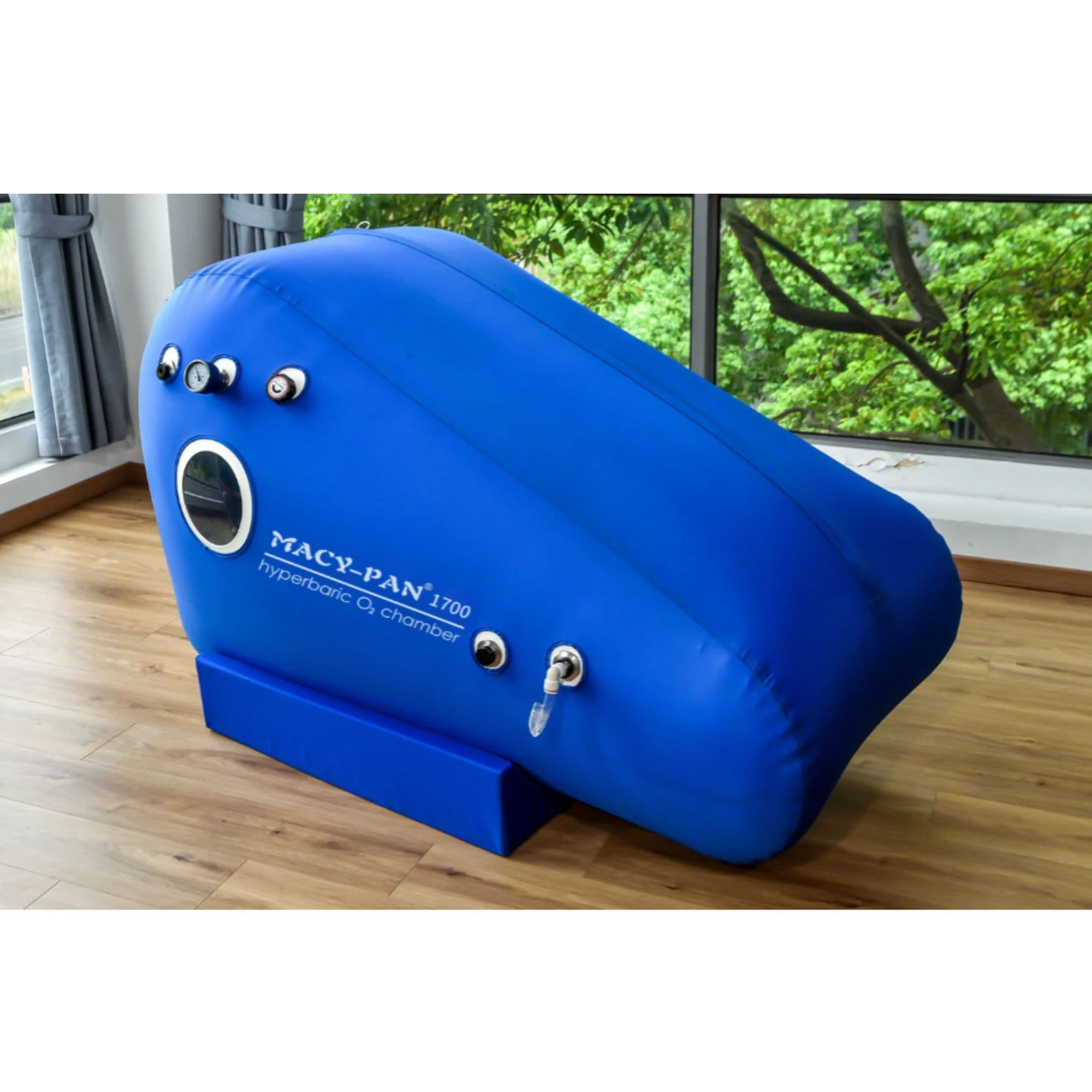 Macy Pan ST1700 Front Top Angle View Of Blue Color Complete Set With Glass Windows And Greenery View Background Background