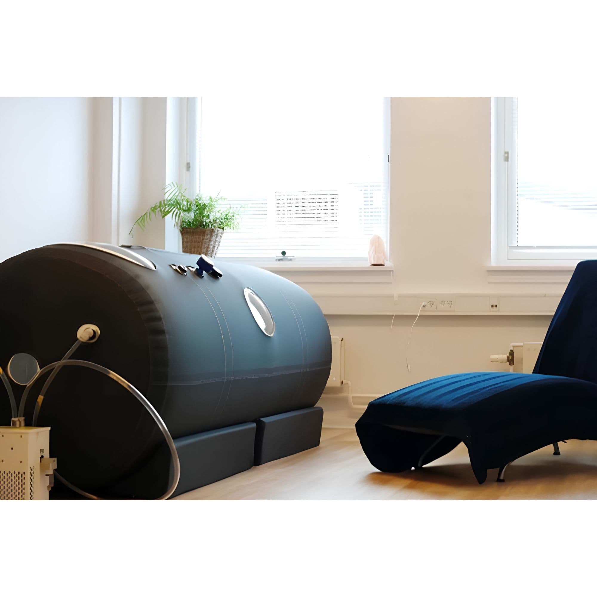 Macy Pan ST701 Portable Hyperbaric Chamber Side View With Lounge Chair By Large Windows