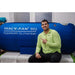 Macy Pan ST901 Portable Hyperbaric Chamber Front View With Man Sitting Beside While Pointing Finger