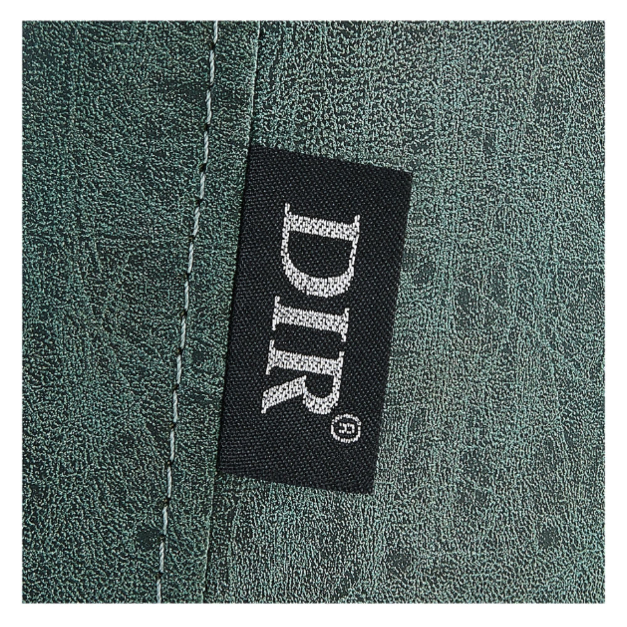 Majesty Antique Barbershop Chairs Close-Up View Of Green Upholstery With Brand Name