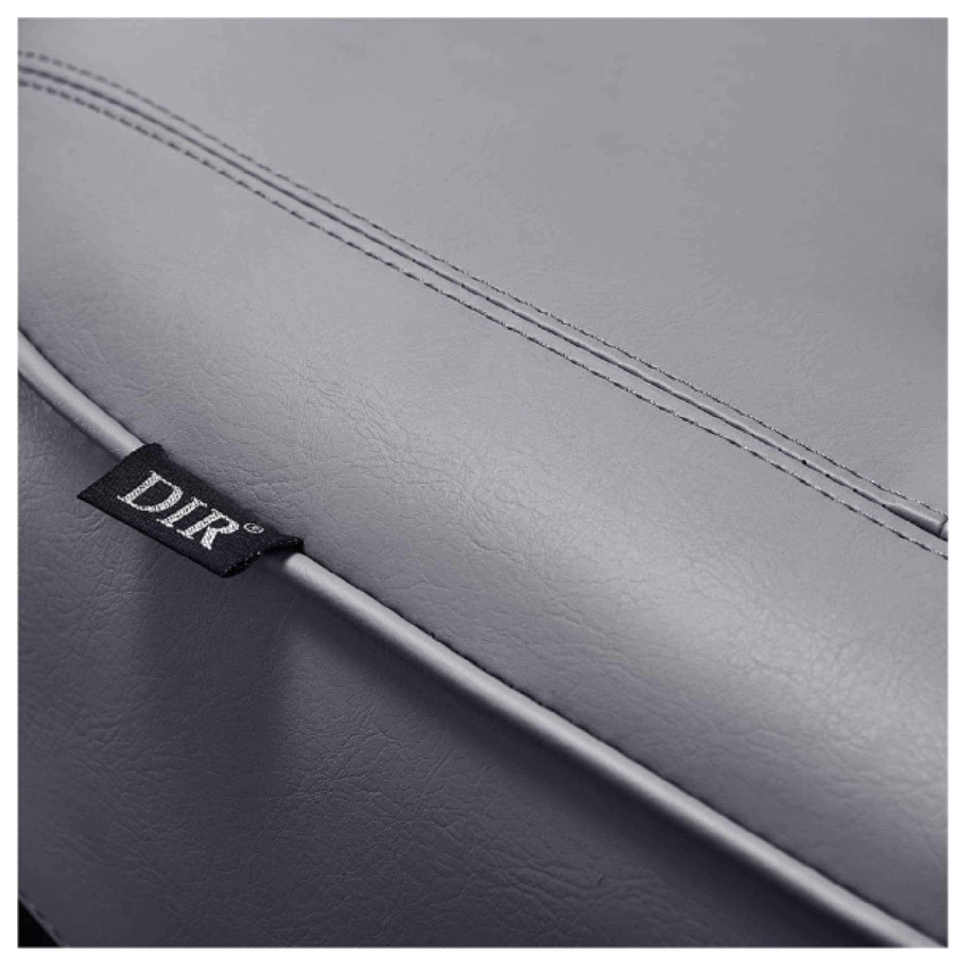 Maximus Reclining Salon Shampoo Bed Close-Up View Of Gray Upholstery With Brand Name