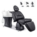 Maximus Spa Reclining Shampoo Bed with Rotating Seat Black Front Angled View With White Sink  And Adjustable Headrest On White Background