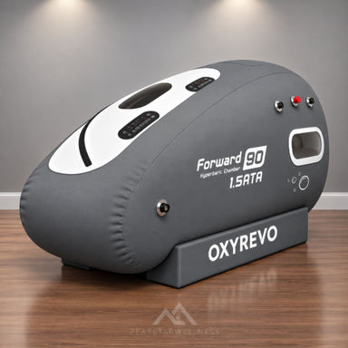 OxyRevo Forward 90 Portable Sitting Hyperbaric Chamber Angled View Of Gray Color On Wooden Floor And Gray Walls