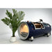 OxyRevo Quest36 2.0 ATA Hard Hyperbaric Chamber Rear Angle View With Potted Plant